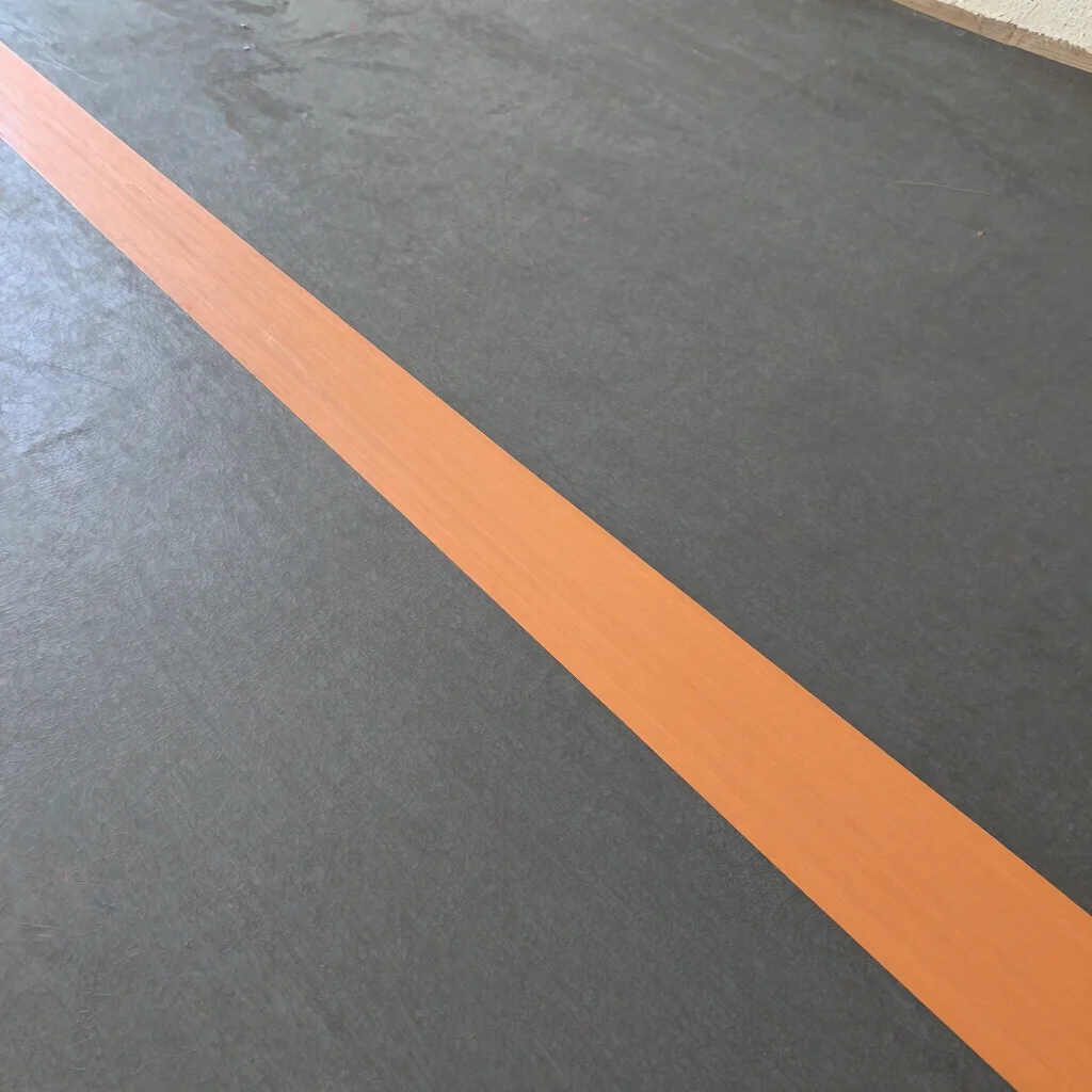 Detail of a floor transition strip, showing a clean, professional
